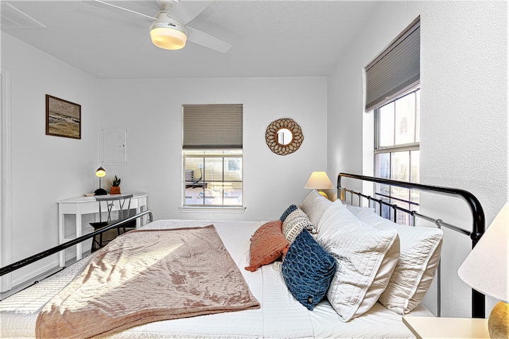 The primary bedroom features a new King-size  bed with memory foam mattress,  two night stands and a dedicated workspace.