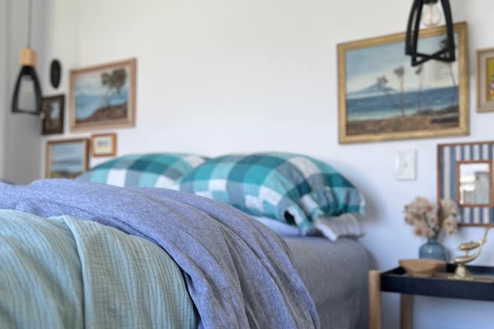 Primary bedroom with ensuite and window seat with daybed. Generous sized room, with beautiful sunlight that comes streaming in.