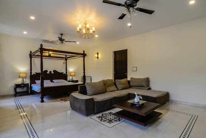 The beautifully done up master bed room comes with a huge poster bed with the best quality mattresses and quilts and comfy pillows to let you have a good nights rest.There is a also a sofa cum bed for some goofing around!!