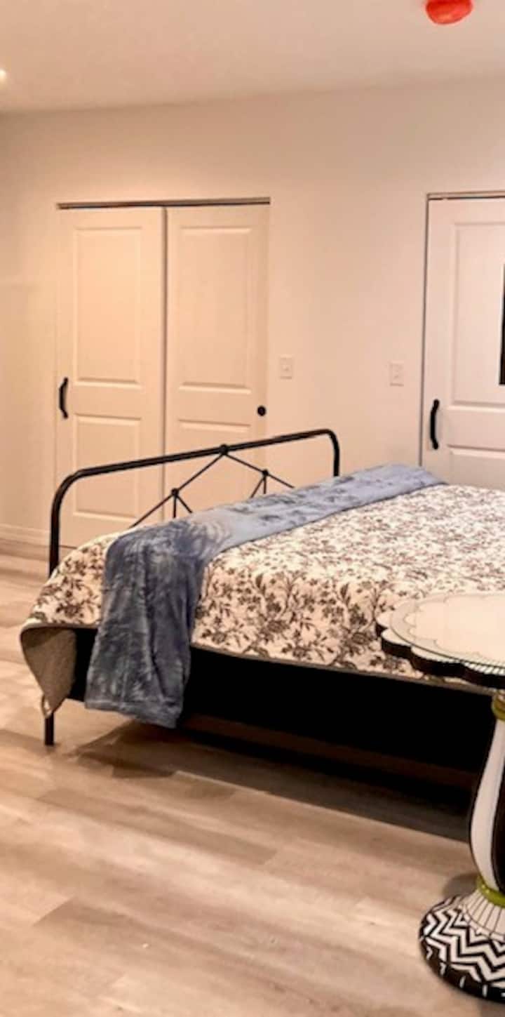 First floor King Suite with large closets, SmartTV, seating area  and private full bath.  