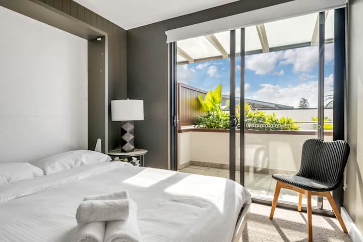 3rd bedroom with northern sunshine on a winter's day. The bed can fold up to reveal a desk. Plenty of room also for the Portacot.