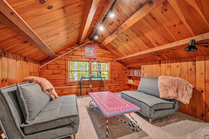 The rest of the loft features the cabin's original wood and holds a small library for kids and adults, games and puzzles.

The seats fold out into individual twin-sized sleeping surfaces. We have a pillowtop, sheets, blankets, and pillow for each.