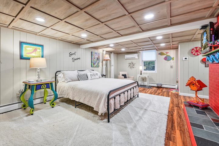 The master primary located on the lower level is very spacious, but still cozy with its gas-fireplace. 

It has a king bed and mounted TV with Comcast cable and a Roku stick to watch streaming services.