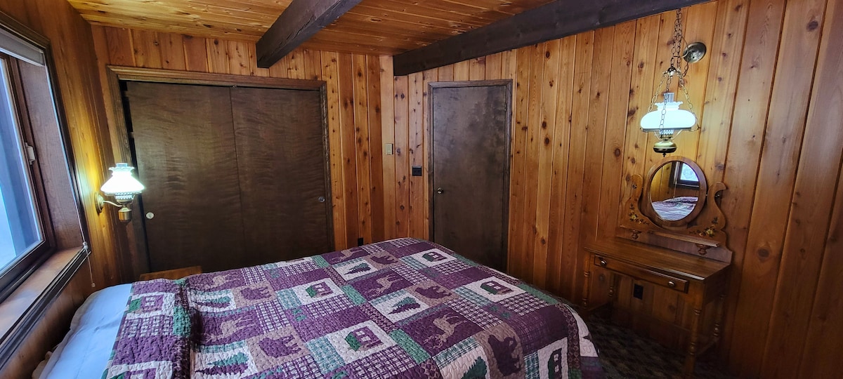 Main floor bedroom with queen bed