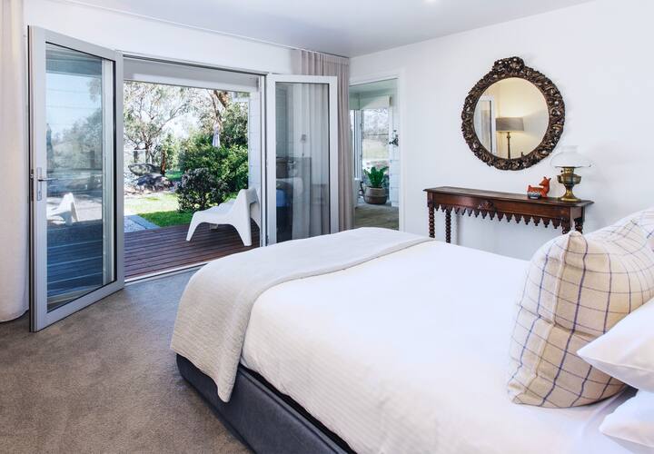 Property 1 (Panorama House) -  Main bedroom with queen bed, garden & pool access, expansive luxury 3 piece ensuite bathroom and  expansive views of Mudgee region.