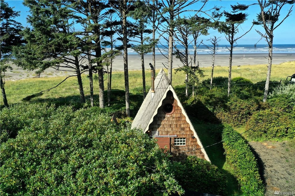Beachfront A-frame cottage with barrel hot tub