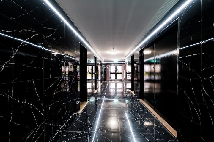 Gorgeous marble tiled building lobby.