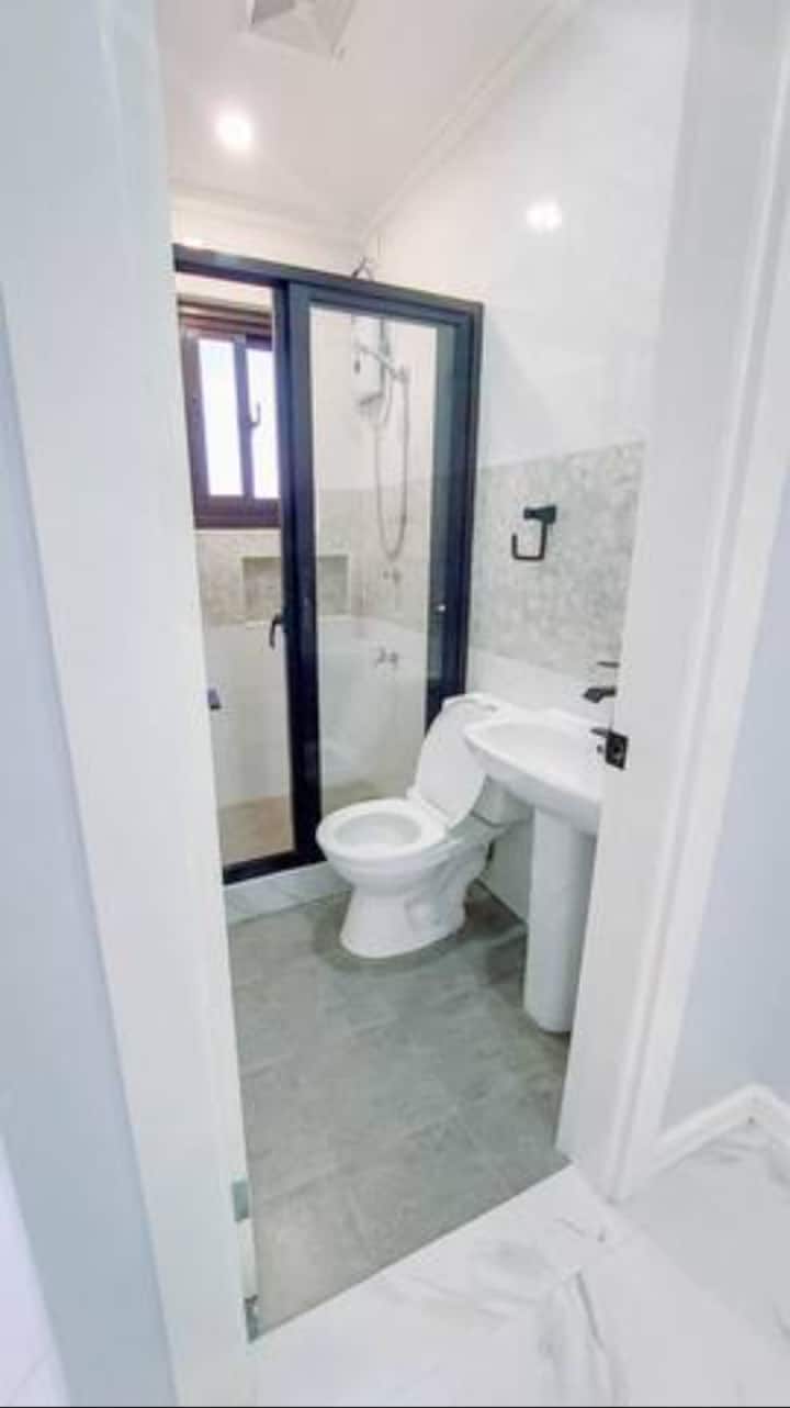 Ensuite bathroom with walk in hot & cold shower with a bidet