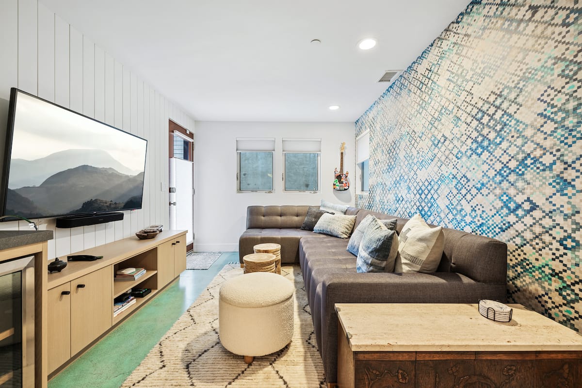 Lower-level TV den with sectional sofa