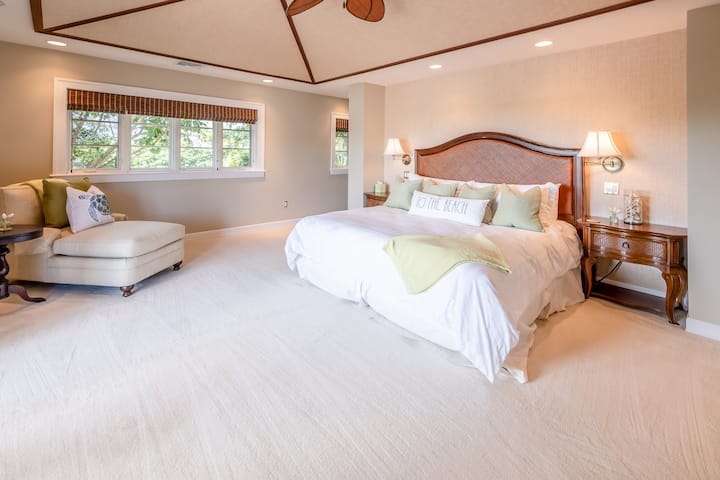 The Primary bedroom with large en suite; central a/c; large walk-in closet; lanai; CA King sized bed with 100% cotton bedding with duvet