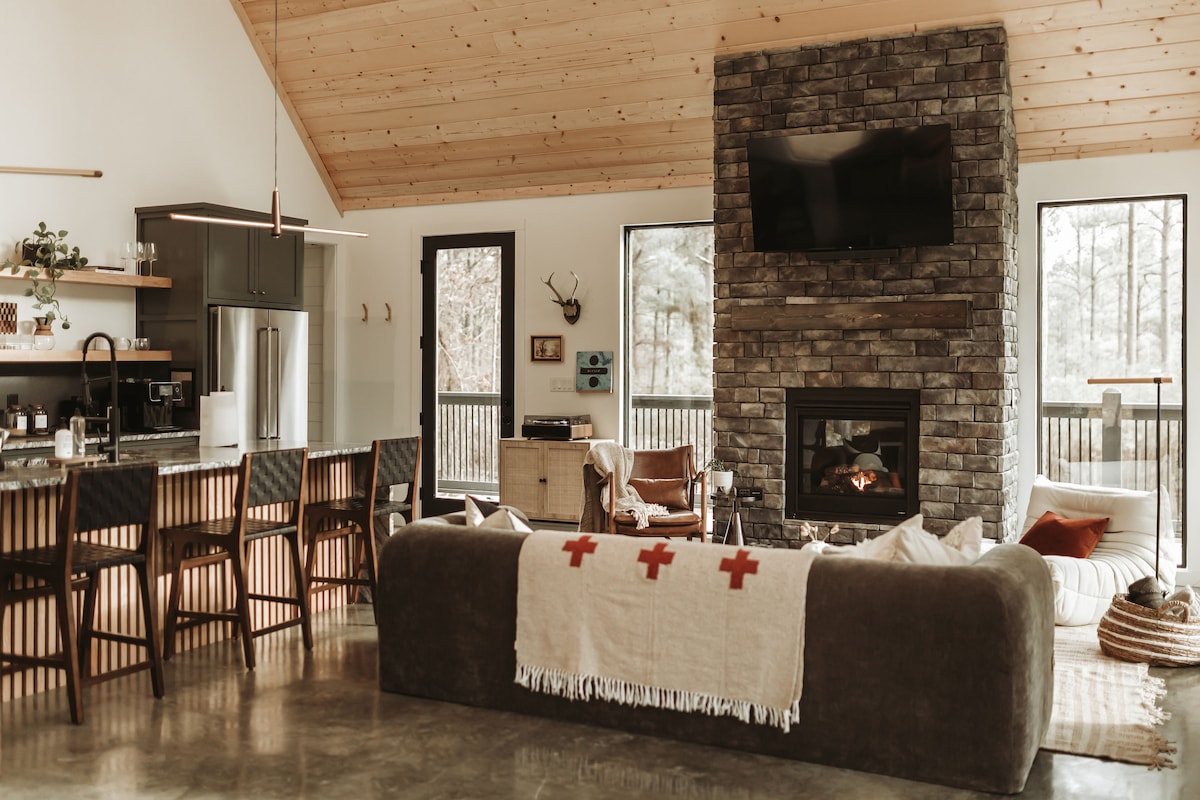 The cozy and stylish setting surrounded by nature. All furniture and design selections were personally curated with high attention to details. The sectional sleeper offers flexibliity to convert into a bed. 