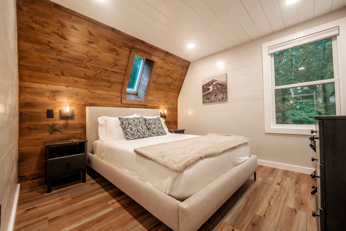 One of two bedrooms downstairs. Each bedroom includes a queen bed with soft and firmer pillows to match your preference. 