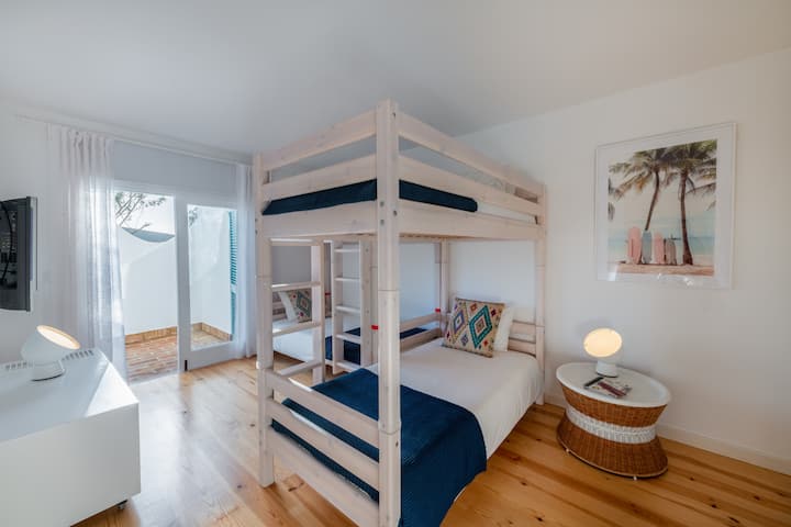 Double bunk bed bedroom with access to patio