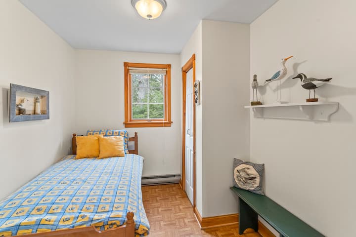 The Bird Room features seabirds, a twin bed and plenty of storage in both the closet and in the bed drawers.