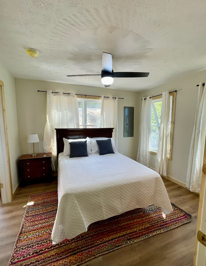 Bedroom 2 with walk in closet and private 1/2 bathroom.