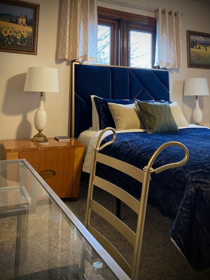 The vintage art-deco Italian nightstands and plush blue headboard and bedding will whisk you away to Tuscany in no time!