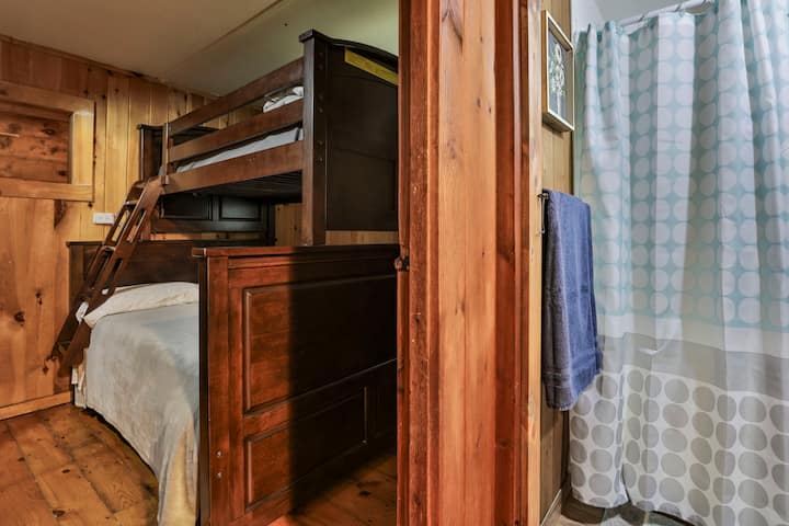 Bunk bed with queen size bed at the bottom and twin bed at the top