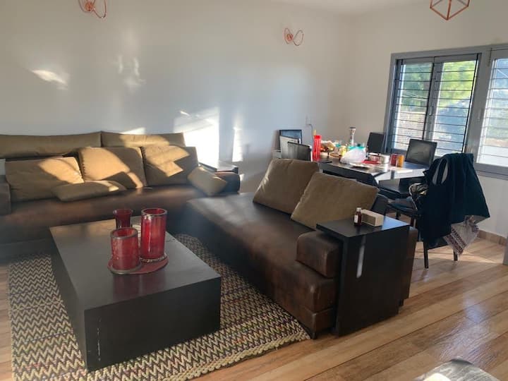 The living area, full of sunlight, have breakfast with a view