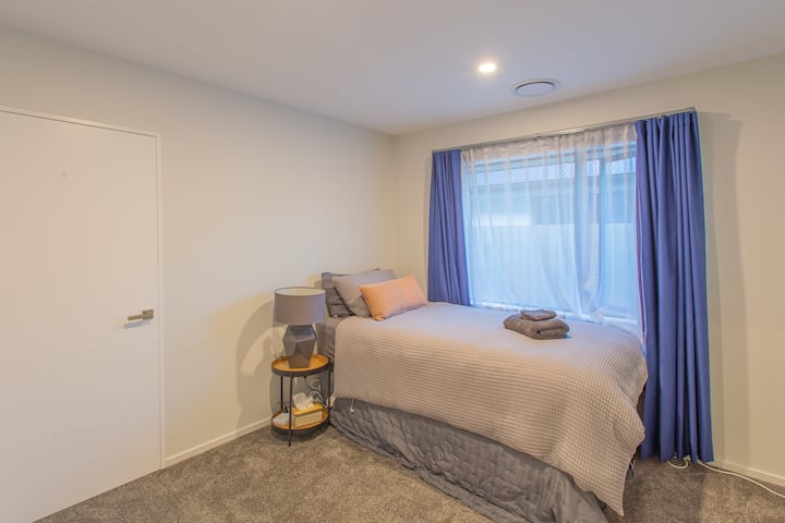 Third bedroom with trundler bed which is set up as two king single beds