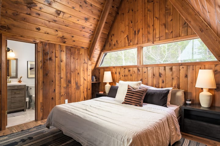 Primary suite with full bath and lounge area.