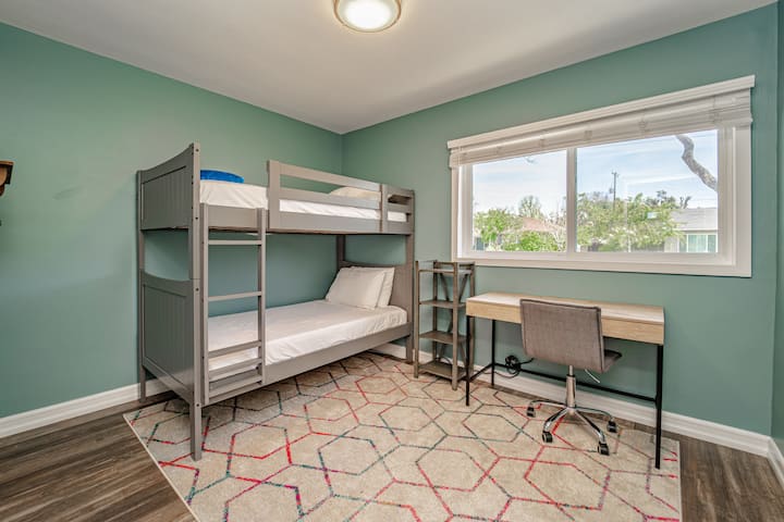 3rd BR: Bunkbeds or home office. Reliable internet and professional background for virtual calls. Closet contains boardgames and children's books. The top bunk is not recommended for large adults.