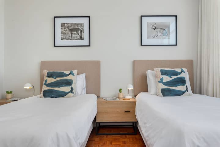 * Second bedroom with stunning ocean views and two comfortable single beds. Both bedrooms have blockout curtains for late mornings.