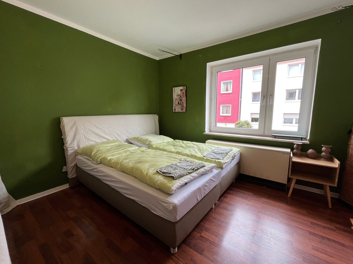 Chambre avec quatre lits simples