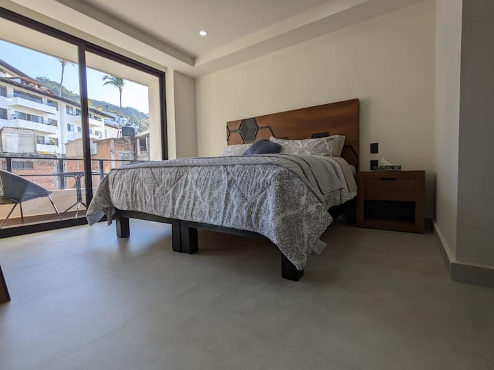 Main bedroom with king size bed, en suite bathroom and large walk-in closet