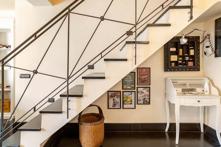 Design stairs that brings you to the loft bedroom from the living area. /Designer staircase that leads from the living area to the loft bedroom.