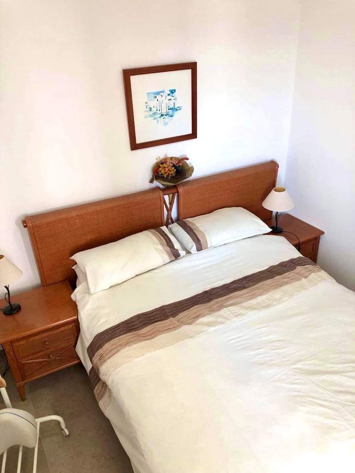 Double bedroom at the back of the villa. Has some sea views, full air con, wifi & a wash/shower room right next door.