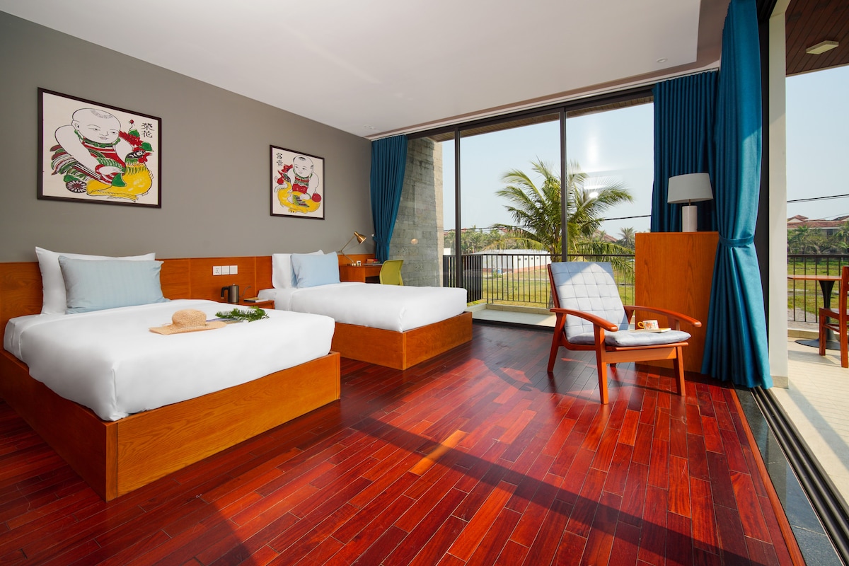 This cozy bedroom features two comfortable single beds that are perfect for friends or family members traveling together.