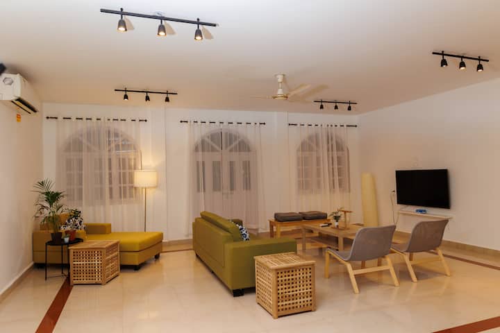 Ground floor living room with reading chair come extra bed