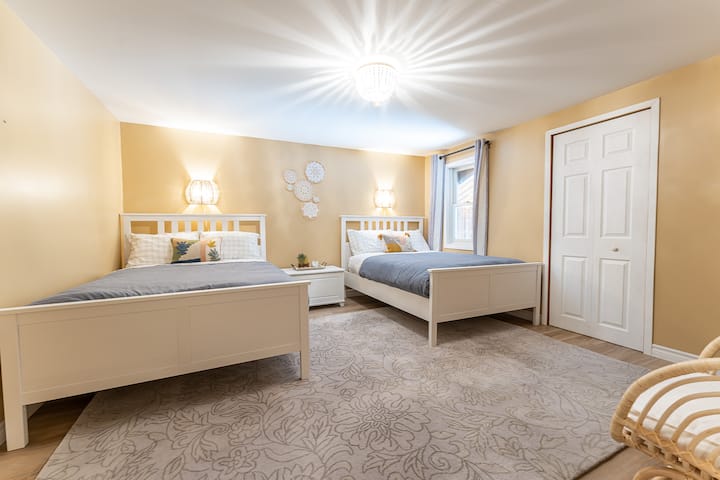Comfortable room with two double beds, perfect for family or friends.