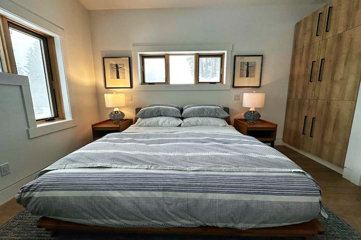 Indulge in comfort with our spacious luxury Airbnb bedroom featuring a king-size bed adorned with top-tier linens and pillows, ensuring a night of unparalleled relaxation. Your best sleep awaits!