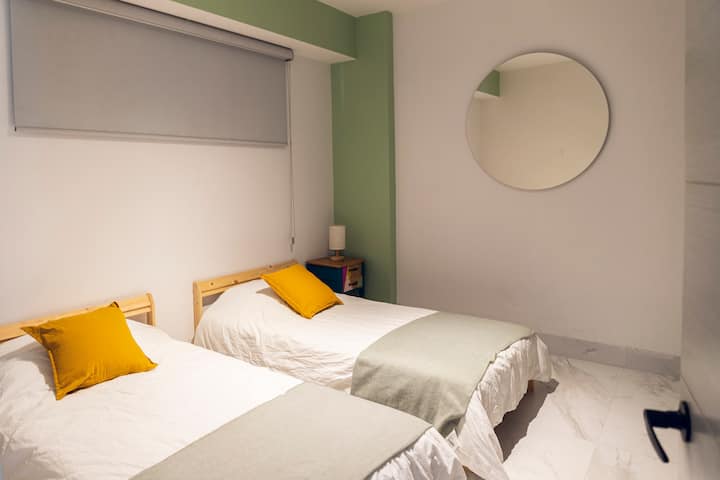 Comfortable second Bedroom with two twin beds that you can put together and sleep 3 people or 3 children :)