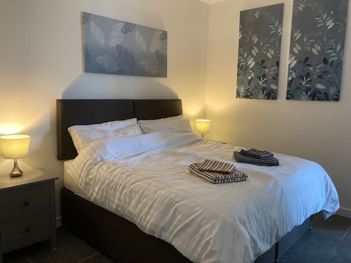 Bedroom 1 with ensuite bathroom, can be arranged as a one Queen bed or two Single beds