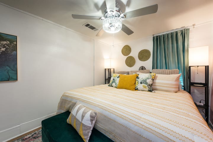 A comfy king-sized bed with plush bedding will make help make your stay amazing!