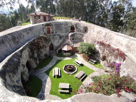 Quadruple room in a cave hotel
