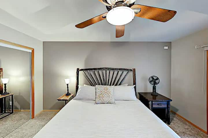 Bedroom #3 is located on the lower level. It has 1 king bed, carpet floor, patio access, ceiling fan, closet, and lovely lake views.