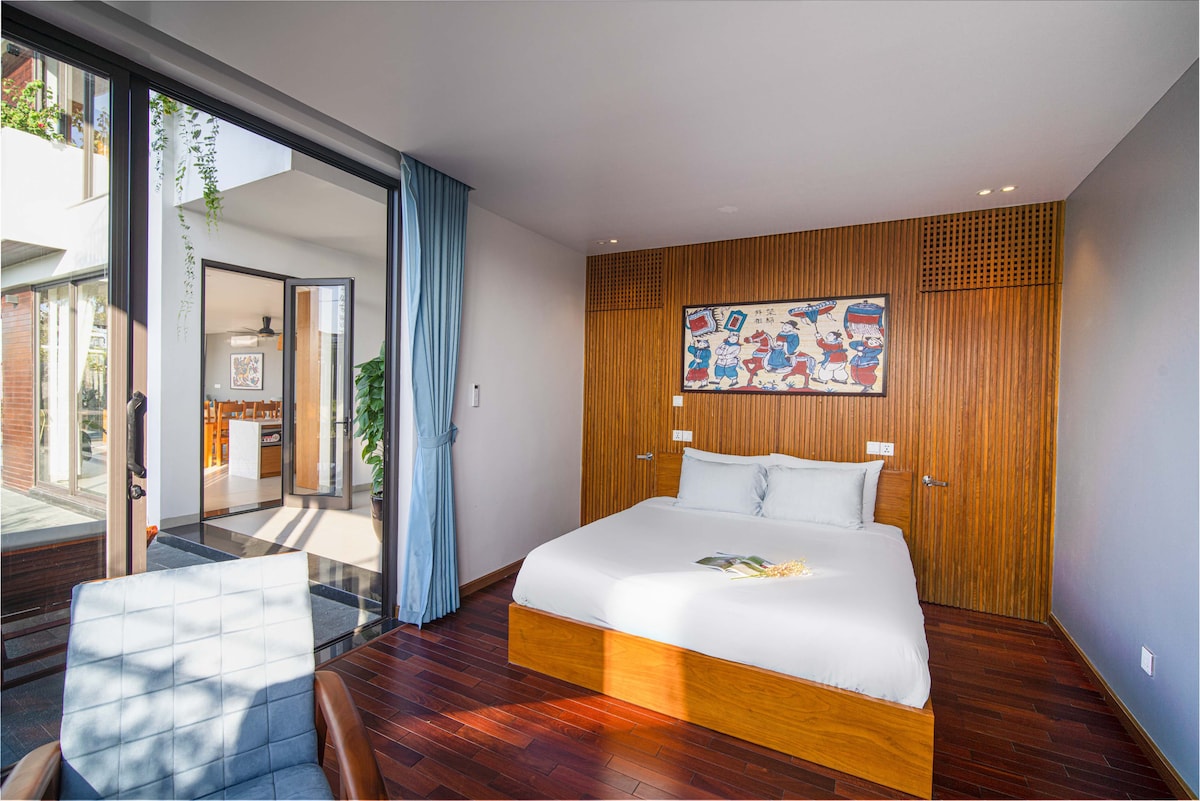 The first-floor bedroom enjoys direct access to both the pool and the adjoining living room and kitchen, creating a seamless flow and offering a unique and inviting living space.