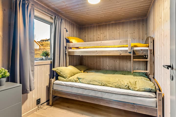 Family room with family bunk. 

150x200 downstairs and 90x200 in the bunk bed.