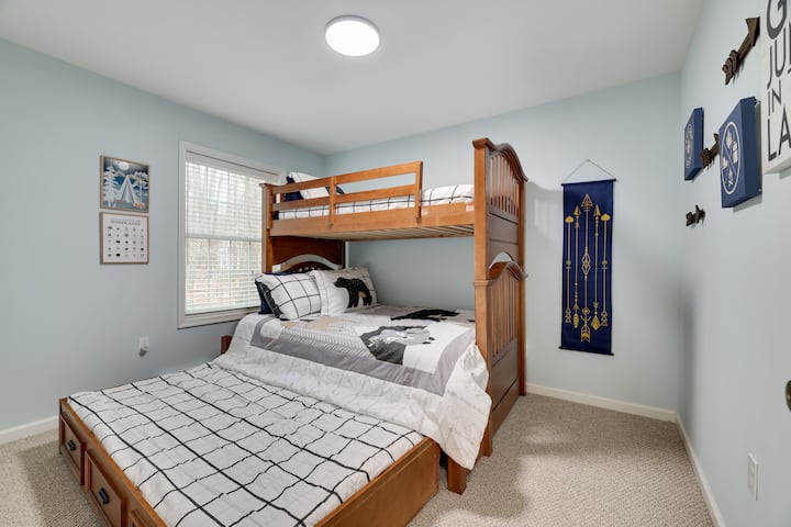 The Woodland Bedroom:
First floor.
Full bed w/ twin bunk above and trundle below.
Smart TV.
Dresser in closet.
 