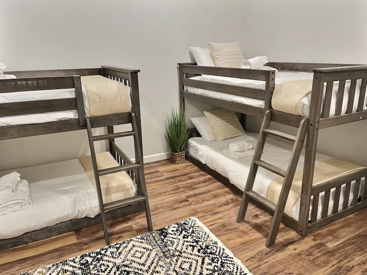 Featuring a luxurious double bed flanked by two charming bunk beds.