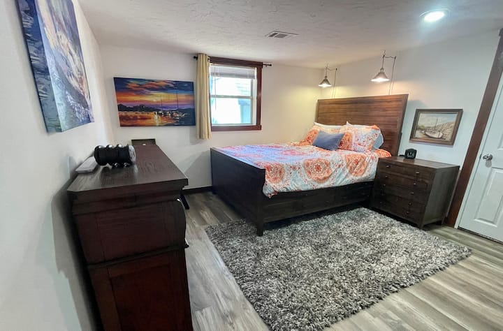 2nd First Mate Quarters where you have a Queen Memory Foam Bed, black out curtains to sleep late and private access to the Master Bathroom.  Your view will overlook the fire pit and outdoor enclosed private yard for games and playing the guitar.