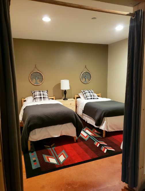 Curtained off twin room off game room