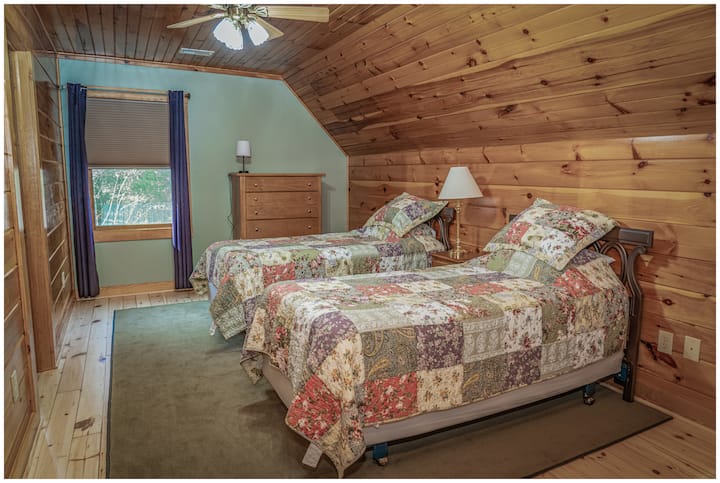 The Broyhill room, one of two cozy rooms upstairs with twin beds, room darkening blinds, and draperies.