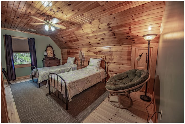 The Price room, one of the cozy bedrooms upstairs, with twin beds, room darkening blinds, and draperies.