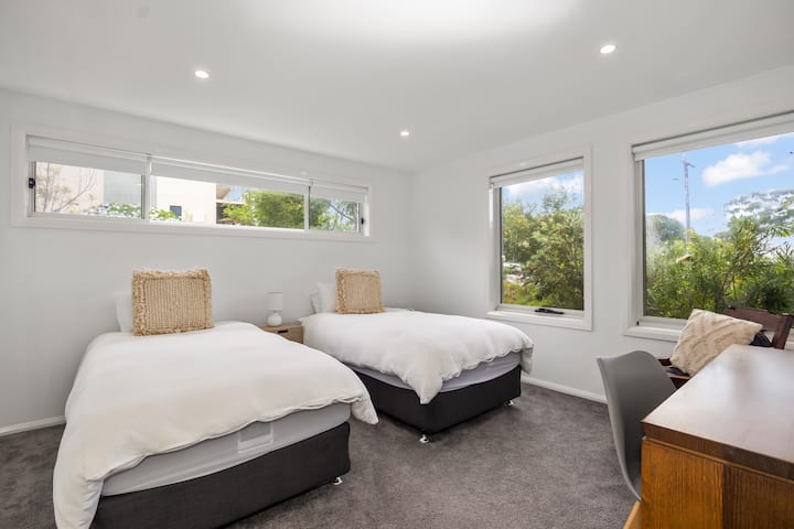 Downstairs bedroom with 2 x single beds. Large sliding doors for cupboard space and built in wardrobe. Study desk available. *This is the only bedroom downstairs, all other bedrooms are upstairs. 