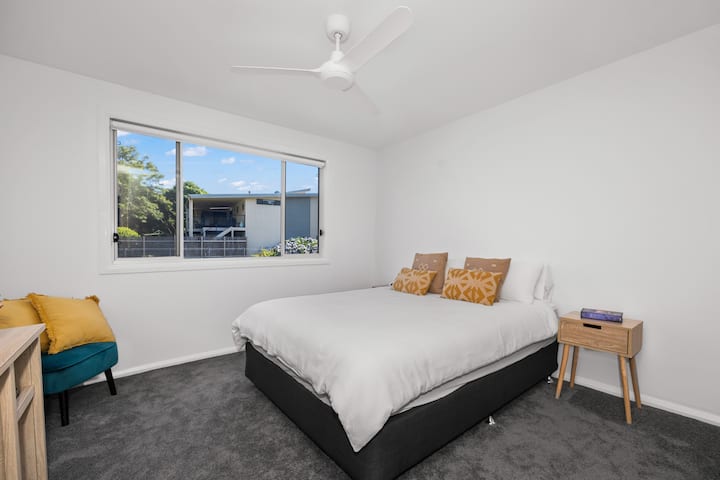 Third Bedroom upstairs with a queen bed, walk in wardrobe and study desk available. Ceiling fans are in each bedroom.