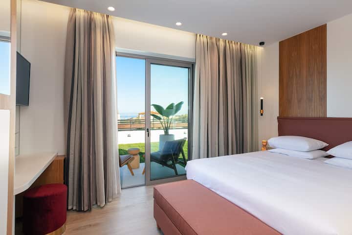 One of ground floor's bedrooms with direct access to pool area.